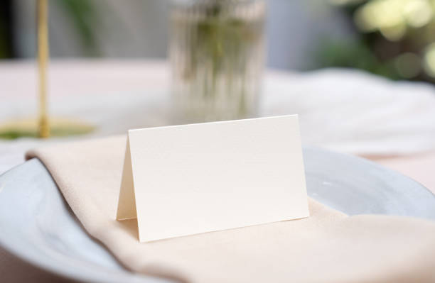 istock Mockup white blank space card, for Name place, Folded, greeting, invitation on wedding table setting background. 2161290877