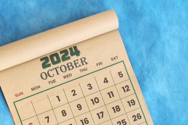 istock October 2024 calendar flat lay in blue background with copy space. 2161291362