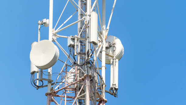 istock White antennas on cell tower close-up. Cell tower with antennas against a blue clear sky, concept of telecommunications equipment, high-speed mobile Internet networks, 5G, 4G, 3G 2161292099