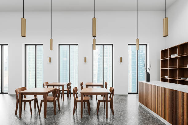 istock Stylish cafe interior with dining table, bar island near panoramic window 2161293379