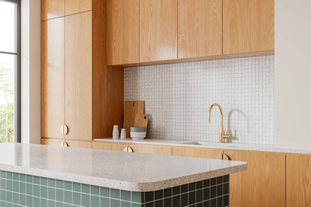 istock Stylish home kitchen interior with bar countertop, cabinet and panoramic window 2161293755