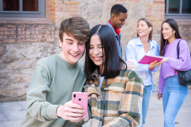 istock Shot two smiling friends browsing an internet application with a smartphone. 2161295552
