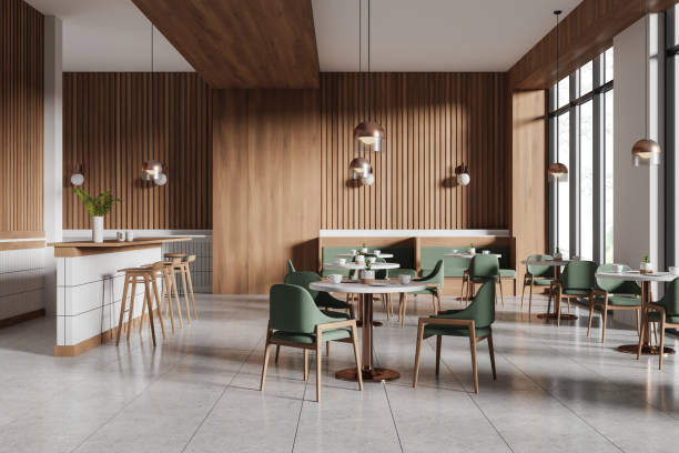 istock Stylish cafeteria interior with bar counter and eating tables in row, window 2161295926