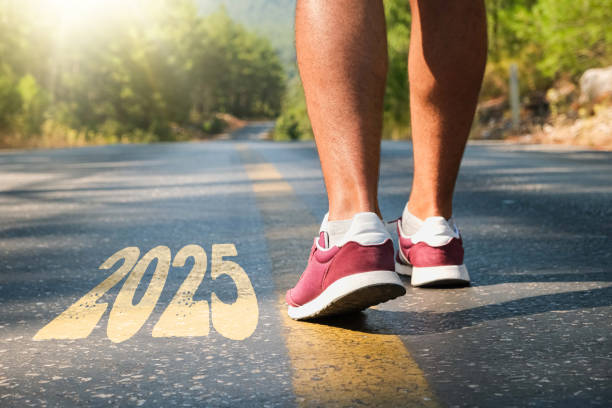 Man walking through the road with the year 2025