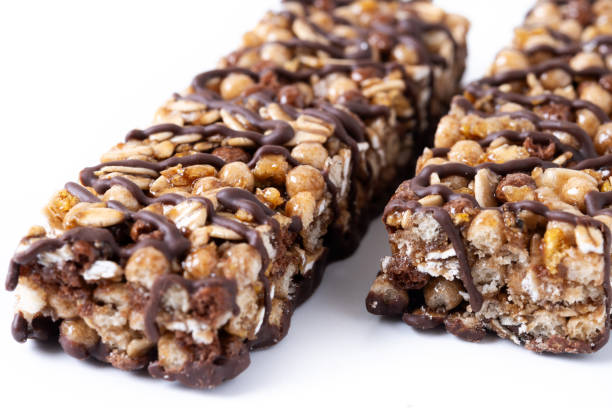 istock Healthy Muesli bars with nuts and black chocolate isolated on white background 2161302518