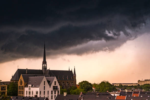 Storm clouds over Zwolle during a summer thunderstrom at the end of a warm and humid summer afternoon. A shelf cloud is approaching over the rooftops and the Dominicanenklooster.