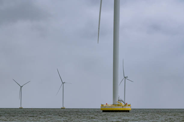 istock Wind turbines in a wind park producing electricity. 2161303322