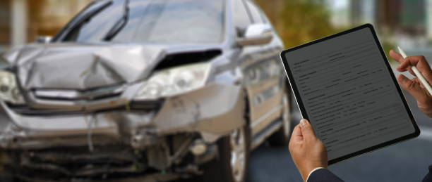 istock agent check insurance claim accident on digital tablet estimated damage done to vehicle on car parking 2161304976