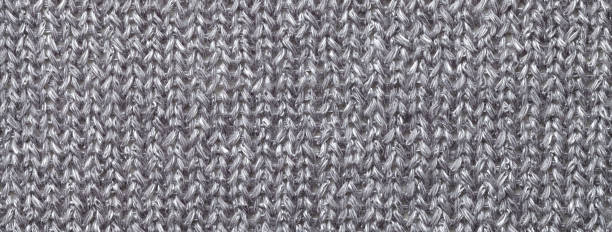 istock Texture of gray color background from woven knitted textile material with wicker pattern, macro. 2161306411