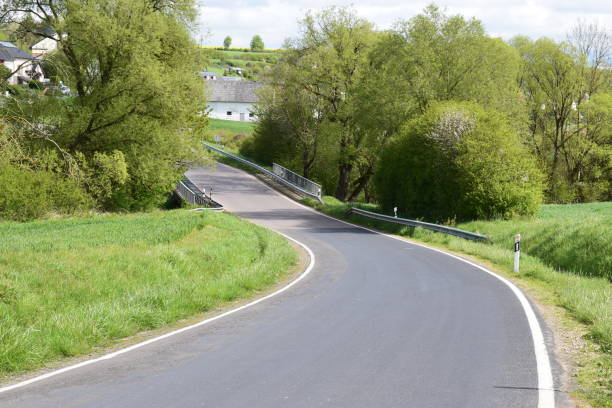istock country road through a valley 2161306864