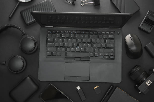 istock Flat lay composition of Modern black gadgets and accessories on a dark black background. Top view 2161307741