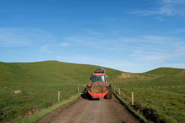 istock Red Tractor with Hay Bales 2161309225