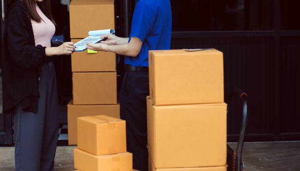 istock Truck Mover Unloading Van Carrying Boxes And Moving House 2161309430