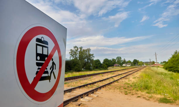 istock Warning Sign Prohibiting Access to Railway Tracks Under the Bright Sunlight 2161311778