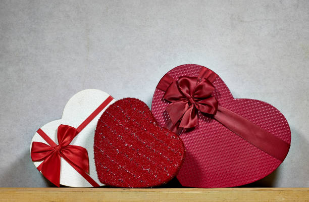 istock different Valentine Heart Shaped Candy Box on wood table 2161312439