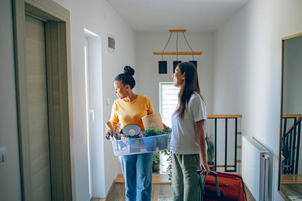 istock Lesbian couple moving in new home 2161312759