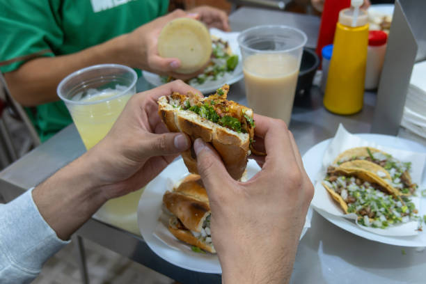 istock Savoring Authentic Torta de Carne de Pastor at a Mexican Eatery 2161312854