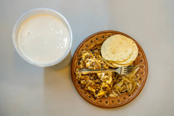 istock Traditional Mexican Alambre with Horchata Drink on a Rustic Clay Plate 2161312910