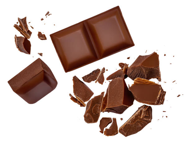 istock  Levitating milk chocolate chunks isolated on white background. Broken chocolate bar pieces and cocoa crumbs  falling on white background 2161313606