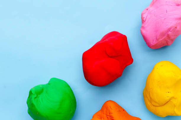 istock Colorful plasticine clay on blue background. 2161314381