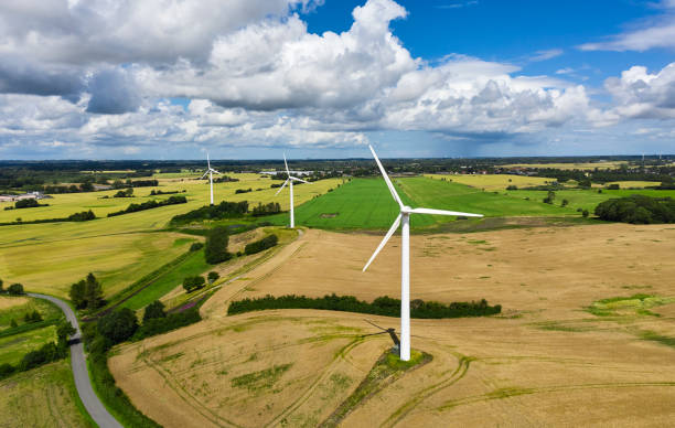 istock One lane road and wind turbines in rural district 2161316553