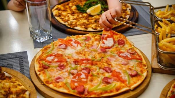 istock Pizza and Fries on a Table 2161317074