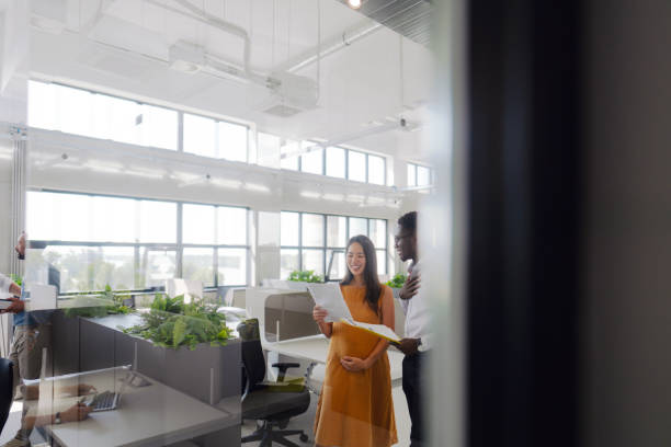 istock Pregnant woman working in the office 2161321397