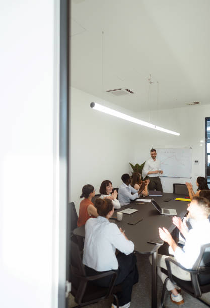 istock A man leading the meeting with his presentation 2161321600