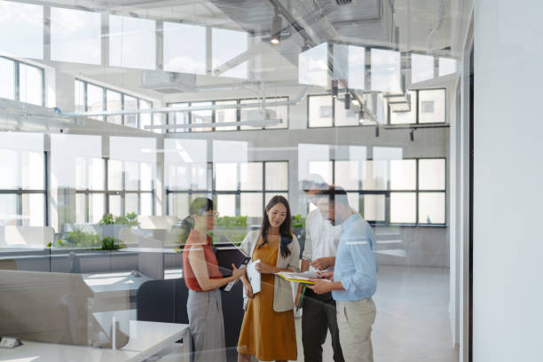 istock Coworkers brainstorming in the office 2161321611