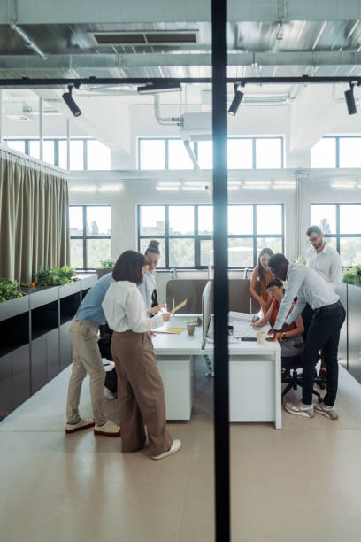 istock Coworkers brainstorming in the office 2161321613