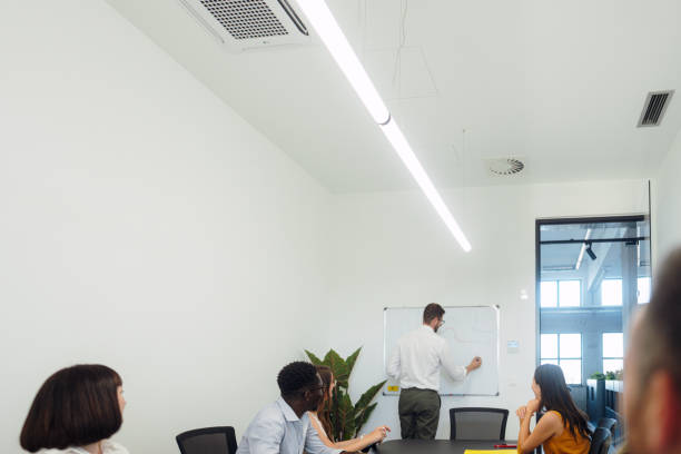 istock A man leading the meeting with his presentation 2161321621