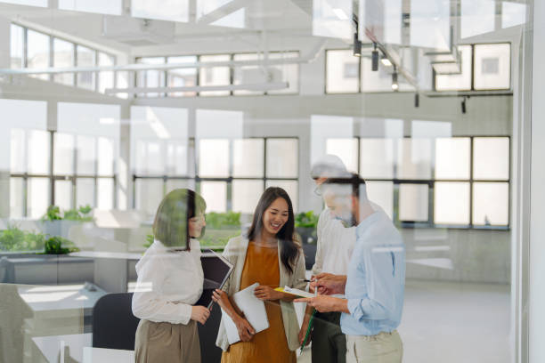 istock Coworkers brainstorming in the office 2161321625