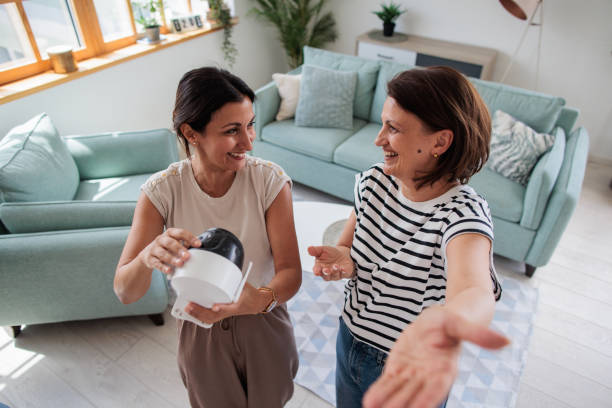 istock Two women installing a home surveillance camera 2161322275
