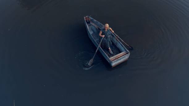istock Top view of blonde rowing  herself a boat 2161326006