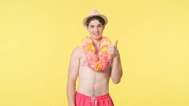 istock A young man shows a thumbs up gesture. 2161327437