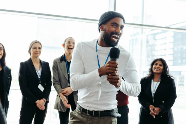 istock Lively corporate conference with happy businessman speaking to enthusiastic team 2161328607