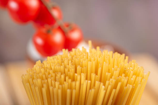 Pasta, table with pasta, ingredients and utensils, selective focus.