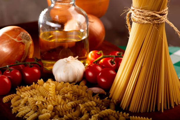 Pasta, table with pasta, ingredients and utensils, selective focus.
