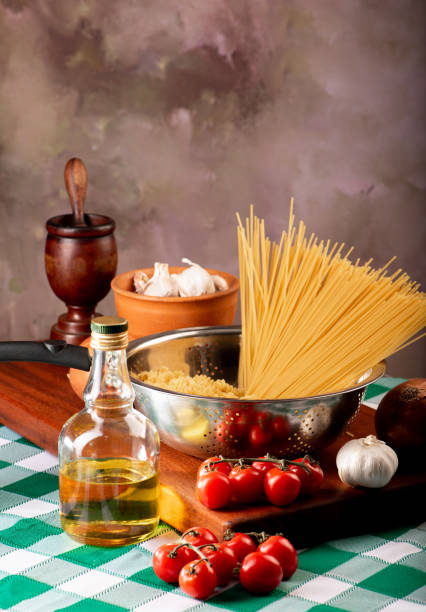 Pasta, table with pasta, ingredients and utensils, selective focus.