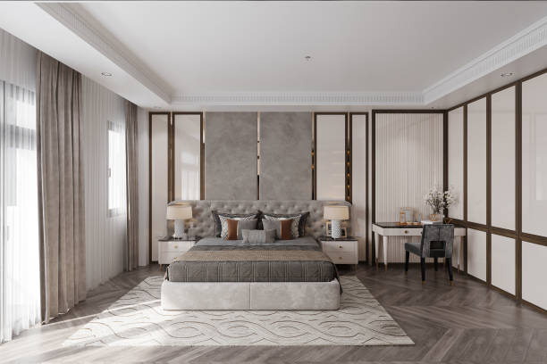 istock A modern bedroom with a gray bed, headboard, and console tables on both sides. 2161329599