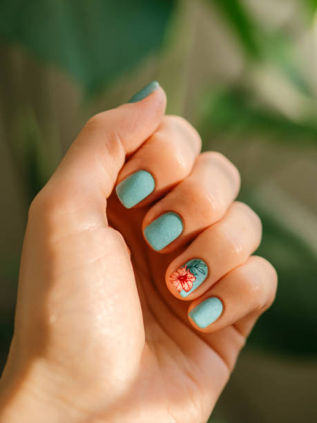 istock Nails with blue teal design and tropical flower 2161329732