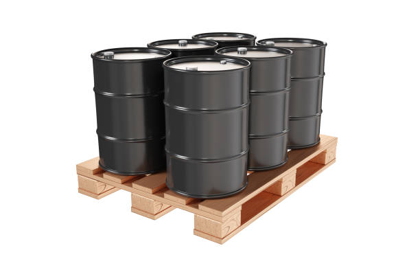 istock Black oil barrels on pallet isolated on white background 2161330392