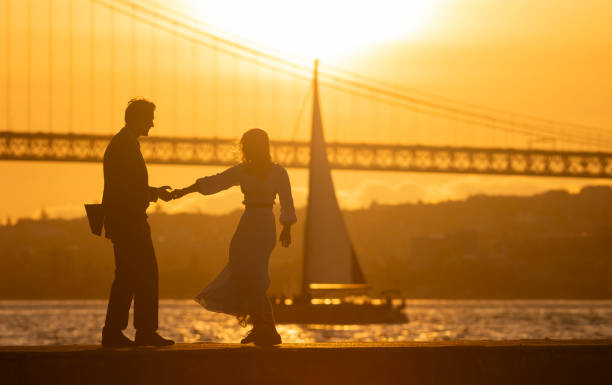 istock A couple is dancing on a pier by the water 2161330869