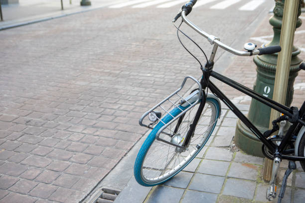istock Bicycle chained to a lamp post with copy space 2161330961