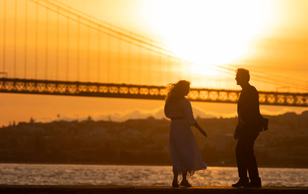 istock A couple is walking on a pier near a bridge 2161331231