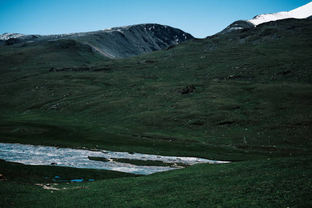 istock Idyllic scene of  mountain river valley under mountain ridge 2161332131