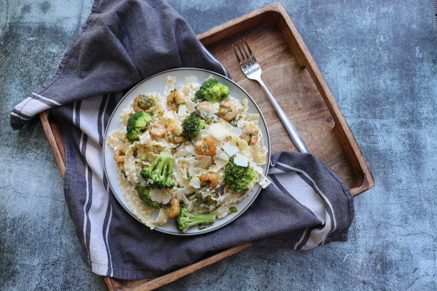 istock Shrimp , pasta with broccoli dish, top view 2161332735