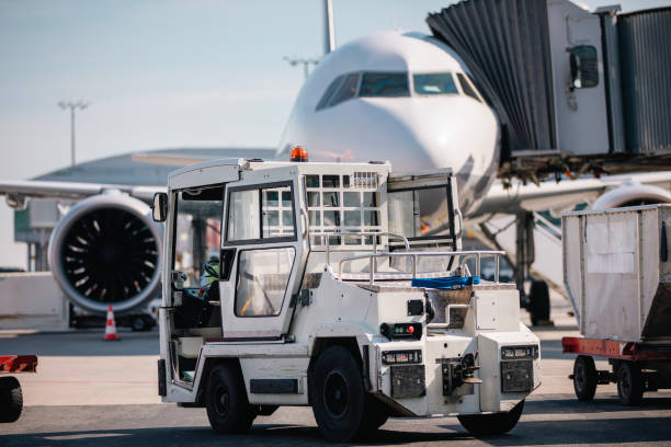 istock Loading of cargo containers to airplane at airport 2161332835
