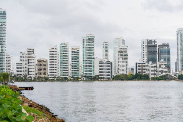 Cartagena, Columbia - 30 November 2024: Skyscrapers line the shoreline of the Port of Cartagena in Colombia.