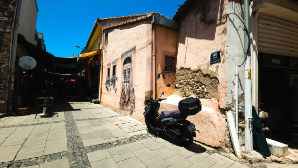 A painted wall and street view in the bazaar in Konak, Izmir, Turkey on 08.07.2024